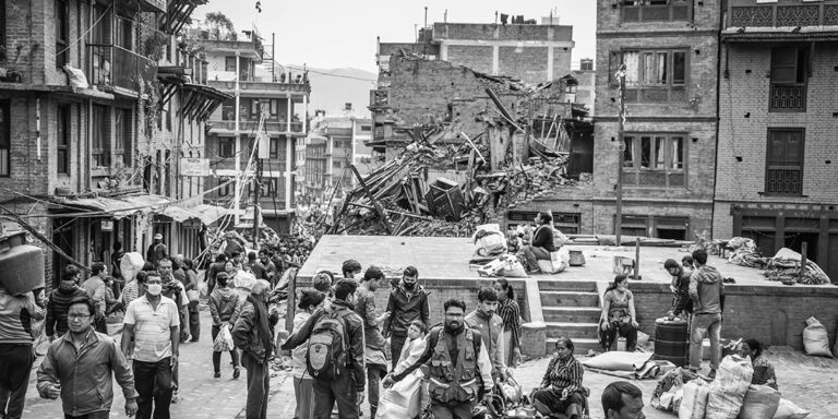 People gathered near destroyed buildings in Nepal